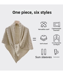 Detail of beige knit shawl showing its hollow crochet texture and multi-use versatility