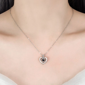 Silver heart projection necklace with I Love You in 100 languages for women