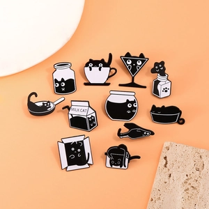 Detailed collection of 11 black and white enamel cat pins in creative container designs