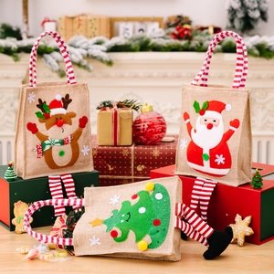 Three-piece Christmas burlap gift bags set with cartoon Santa Claus and reindeer appliques