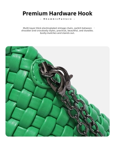 Close-up of vibrant green woven leather bag featuring gunmetal hooks and chain detail