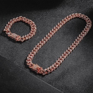 Detail of rose gold Cuban link necklace and bracelet set with sparkling zircon stones