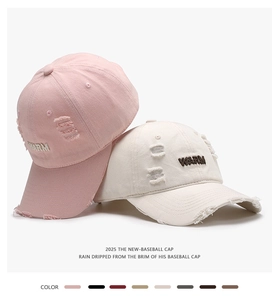 Détails de casquettes en coton rose et beige avec broderie WARM et finitions usées