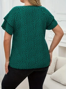 Back view of polka dot blouse with ruffle sleeves and slim fit round neck in green and black