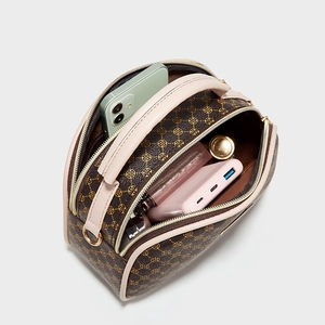 Women's vintage print crossbody bag with multiple compartments and a spacious interior