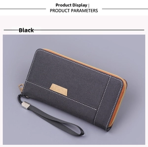 Détail d'une pochette en toile noire avec 12 fentes pour cartes et fermeture éclair dorée