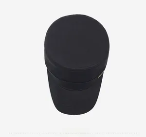 Top-down view showing the flat top structure and metal detail of the black cadet cap