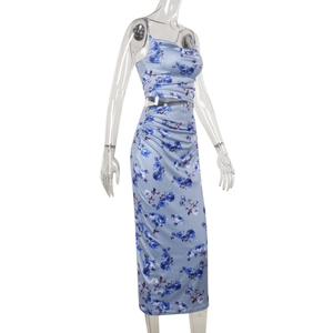 Detail of blue floral two-piece set featuring a crop camisole and drawstring maxi skirt