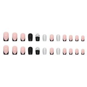French black and silver glitter press-on nails with pearl accents in almond shape