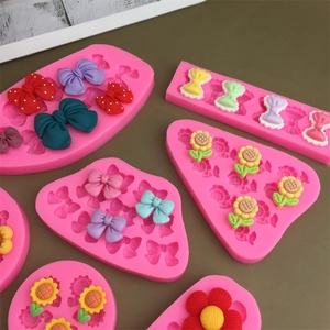 Pink silicone sunflower and bow molds with colorful resin floral decorations