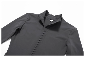 Detail of dark grey yoga bodysuit with stand collar and smooth thermal fabric