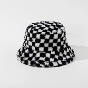 Macro view of soft checkerboard plush bucket hat texture and pattern