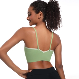 Detail of lime green sports bra featuring thin adjustable straps and elegant V-back design