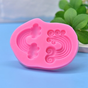 Pink silicone wave mold with rainbow and cloud designs for DIY soap and candle making