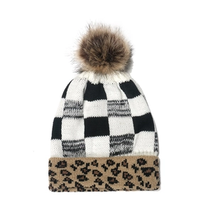 Winter knitted pompom hat with checkerboard pattern and leopard print brim for warmth