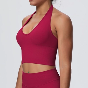 Detail of burgundy ribbed seamless sports bra with halter neck and matching yoga pants