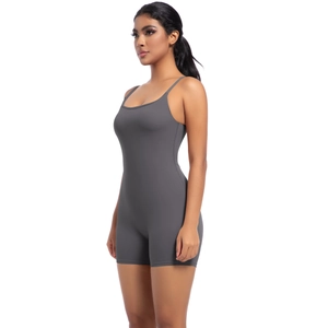 Close-up of seamless charcoal grey yoga bodysuit with thin straps and sleek matte texture