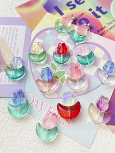 Detail of colorful gradient tulip beads for DIY jewelry making in various pastel shades