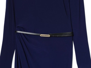 Detail of navy blue pleated dress featuring a slim black belt with gold buckle detail