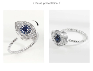 Detail view of rotating S925 silver evil eye ring with blue and white zircon stones