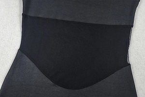 Detail of high-neck sleeveless dress featuring breathable mesh and smooth fabric paneling
