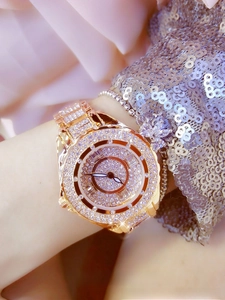 Detailed view of rose gold women's watch featuring a full diamond pavé crystal bracelet