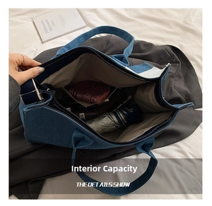 Detail view of the spacious interior of a blue and white patchwork denim tote bag