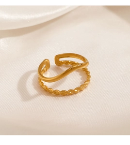Close-up of dual-layer 18K gold-plated ring with twisted and smooth wave texture