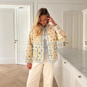 Women floral quilted jacket in cream with blue contrast piping and vintage flower pattern