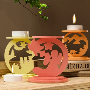 Three creative hollow silhouette candle holders with cat and forest patterns