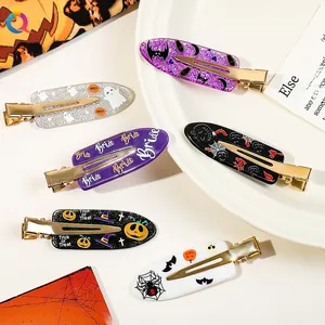 Detailed set of Halloween hair clips featuring pumpkins, ghosts, and bats on a white background