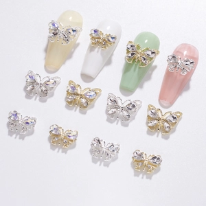 3D hollow butterfly nail charms in gold and silver metal with sparkling crystals