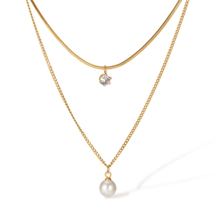 Double-layered gold titanium steel necklace featuring a zircon charm and white pearl pendant