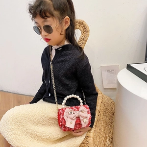 Red tweed mini crossbody bag for girls with pearl handle and pink bow accent