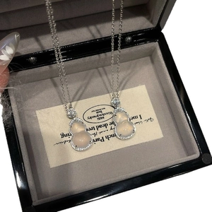 Silver stainless steel necklace with zircon-encrusted gourd pendant in a jewelry box