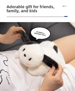 Detailed close-up of soft plush toy with black ears and subtle floral scent feature