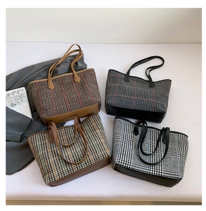 Close-up of four tweed checkered tote bags with leather handles and plaid patterns