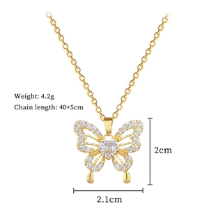 Detailed view of hollow butterfly pendant with zircon heart showing size and weight specs