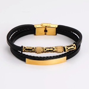 Detail of multi-layer black leather bracelet with gold stainless steel clasp mechanism