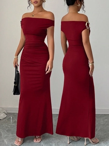 Detail of off-shoulder dark red slim fit evening gown with elegant pleated texture