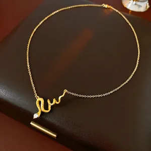 Luxurious gold-plated snake pendant necklace with shimmering white zircon on leather base