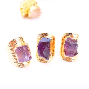 Irregular raw purple amethyst crystal rings with hammer-textured adjustable gold bands