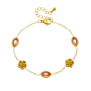 Detail of gold chain bracelet with pink crystals and rose flower charms with lobster clasp