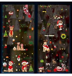 Detail view of double-sided Christmas window clings featuring cute cats and snowflakes