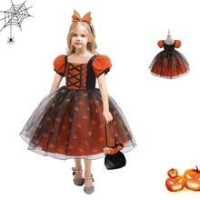 Detail of girl's pumpkin dress with orange mesh tutu and matching headband