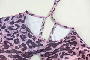 Close-up of purple leopard print bodysuit neckline with stylish halter tie design
