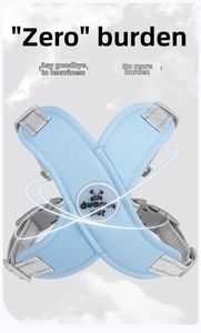 Detail of light blue X-shaped dog harness with adjustable straps and secure buckle