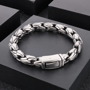 Detailed view of a 10mm stainless steel curb chain bracelet with fold-over safety clasp