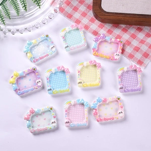 Macro detail of miniature resin plates featuring colorful cartoon patterns and bow motifs