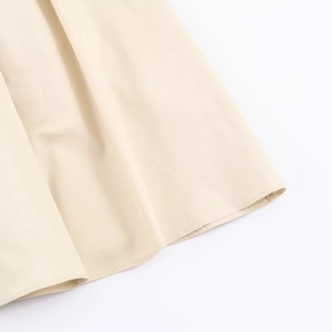 Close-up of the refined stitching and premium fabric texture on the midi dress hem